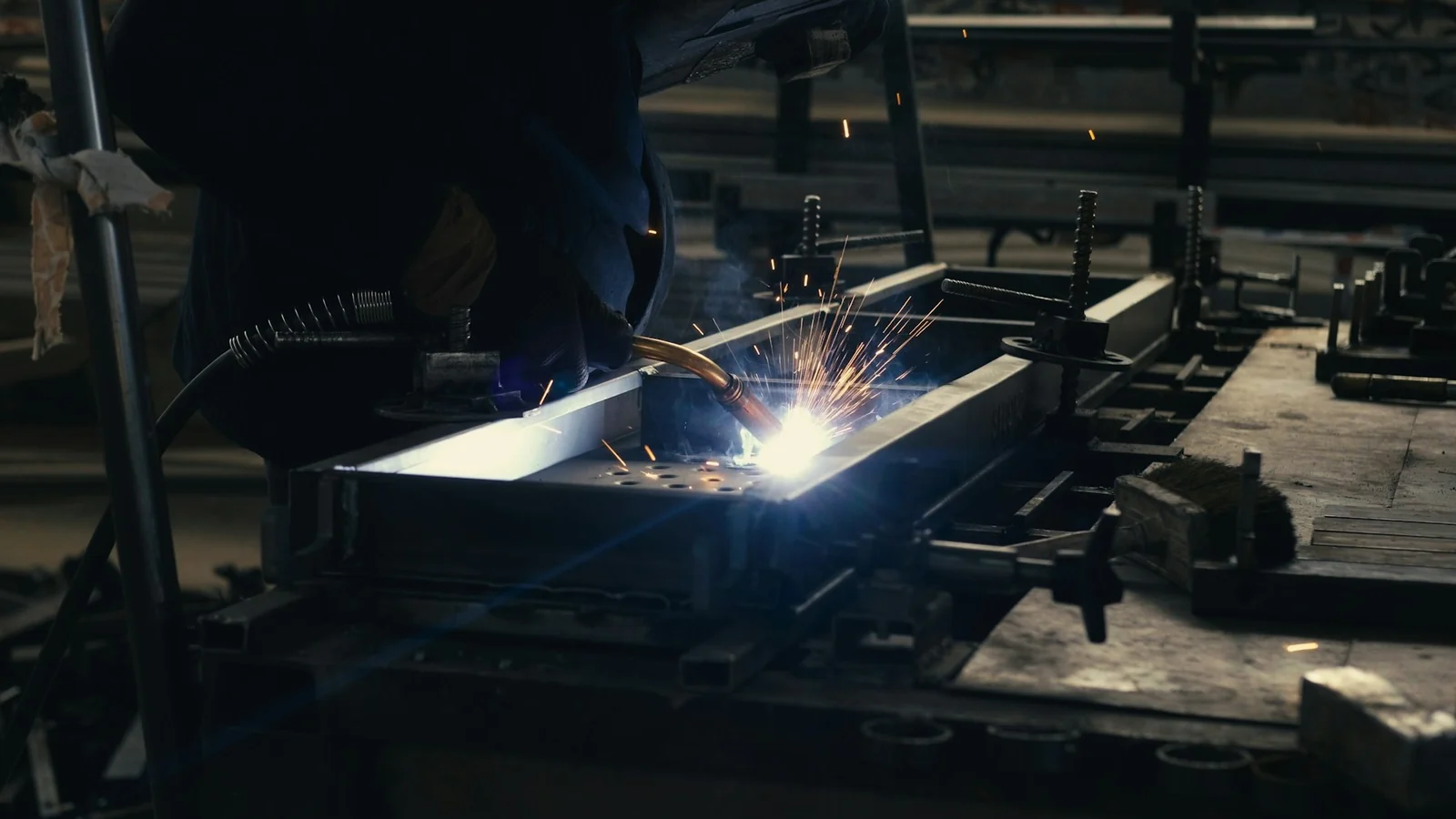 Welder fabricating a metal assembly